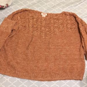 This is a tan sweater.